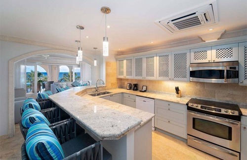 Little Battaleys Apartment | St Peter's Bay 402 - Modern Beachfront Condo