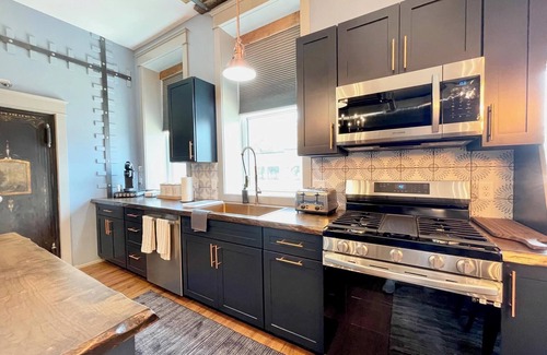 Nelson Condo | Stay Historical - Boiler Maker Office Turns Vacation Destination