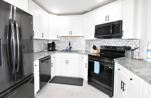 Cocoa Isles Country Club Condo | Stay Where Dolphins Play,Water Front