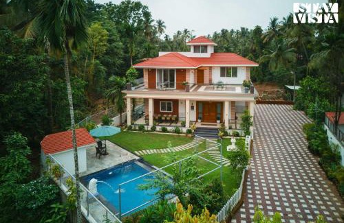 Nagaon Villa | StayVista at 27 Flora with Lawn, Pool, WiFi
