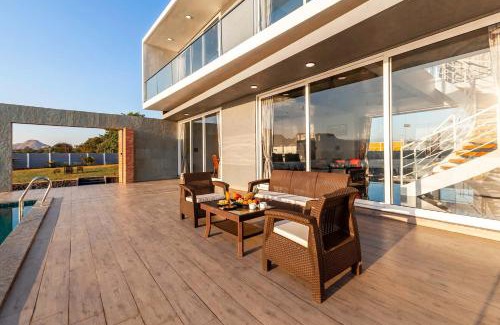Nashik Villa | StayVista's Bellisimo Panorama - Lakeside Oasis with Infinity Pool, Modern Interiors, Open-to-Sky Bathtub, and Lush Green Lawn
