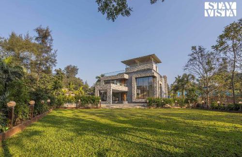 Kune Village Villa | StayVista's Greystone Estate with Pool, Theater, Terrace, and Snooker Table