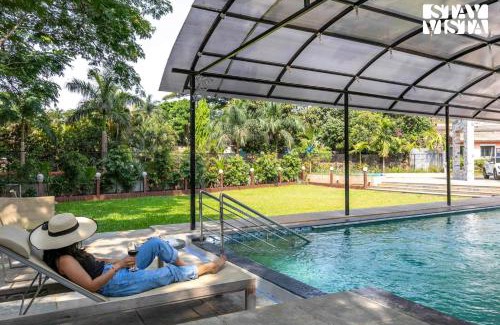 Kune Village Villa | StayVista's Greystone Estate with Pool, Theater, Terrace, and Snooker Table