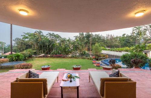 Khandala Villa | StayVista's Shantam House - Dive into relaxation with a pool and tennis lawn
