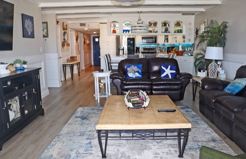 New Smyrna Beach Condo | Steps to south pool deck, pool and ocean from this ground floor, three bedroom, three bath sleeps 8.