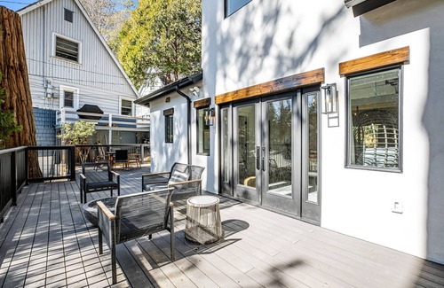 Cedar Glen House | Stunning lakehouse lodge with a deck, fireplace, lush patio & lake access