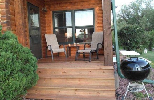 Grantsburg Cabin | Stunning log home with a rental pontoon on a quiet sunlit bay. Check it out!
