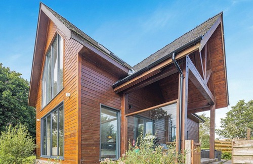Menai Bridge Ski Chalet | Stunning two storey contemporary lodge on the edge of the lake.