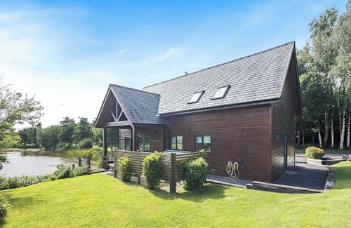 Menai Bridge Ski Chalet | Stunning two storey contemporary lodge on the edge of the lake.