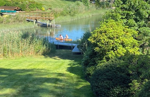 Riverside House | Stunning waterfront house with dock, walk to shops, restaurants, beach, train.