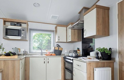 Aberystwyth House | Stylish and modern caravan with one double and two twin.