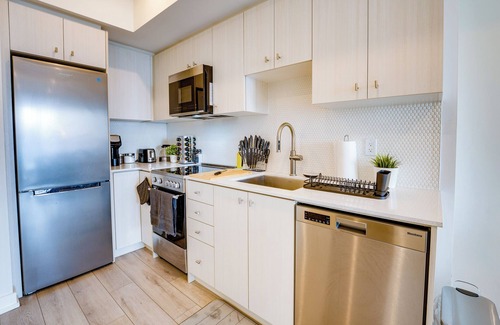 Kitchener Apartment | Stylish Open Concept Condo w/Gym