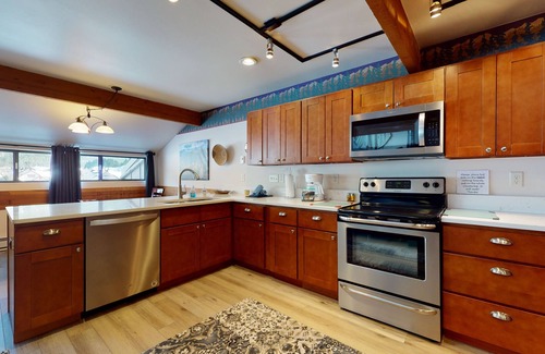 East Village at Copper House | Stylish townhouse with mountain and golf views, shared hot tub, and balconies