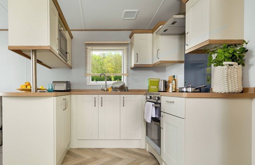 Truro House | Stylish with a touch of luxury 12ft-wide caravan with one double and two twins.