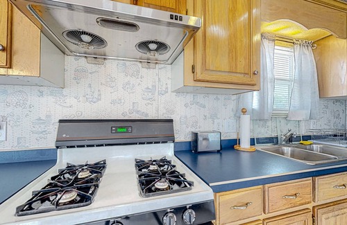 Assateague Pointe House | Sunny coastal home with private patio, on-site pool, central AC, & W/D
