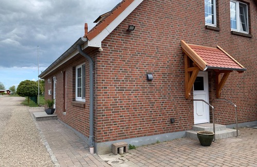 Albertsdorf Apartment | Sunny Sundblick accommodation with garden, terrace and wood-burning stove on Fehmarn