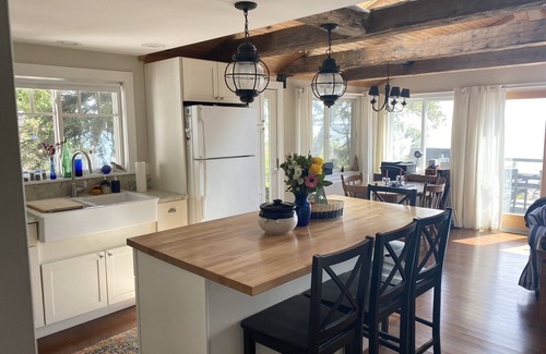 Prospect Harbor House | Take in the breathtaking views at our popular oceanside cottage with large deck.