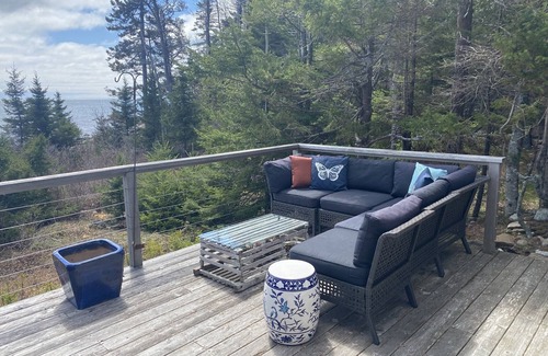 Prospect Harbor House | Take in the breathtaking views at our popular oceanside cottage with large deck.