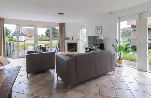 Makkum Villa | Thatched villa with terrace on the water at a holiday park in Friesland