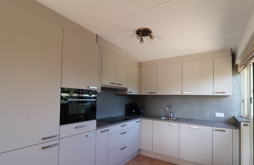 Makkum Villa | Thatched villa with terrace on the water at a holiday park in Friesland