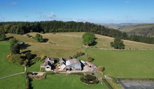 Oswestry House | The Barn at Pentregaer Ucha, with tennis court and lake