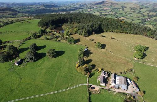 Oswestry House | The Barn at Pentregaer Ucha, with tennis court and lake