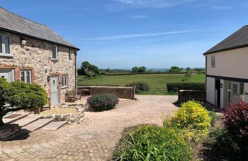 Oswestry House | The Barn at Pentregaer Ucha, with tennis court and lake