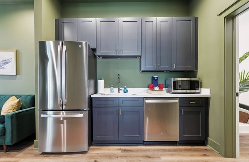 New Orleans Hotel | The Bayou Room at Faubourg Orleans. Queen Suite with living area and kitchenette