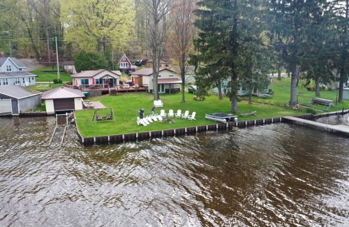 Ludington Cottage | The Bunkalow Lakefront Compound w Lifts for your Speed Boat & Tritoon