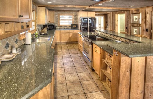 Clarkesville House | The Cove at Lake Burton | Vintage Lakefront Home with Covered Boathouse Deck