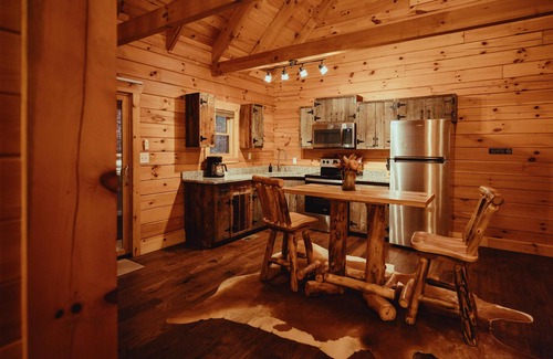 Rockbridge Cabin | The Hilltop - The Hilltop at Pine Creek Cabins and Camping in Hocking Hills, just minutes from Hocking Hills State Park. A cozy, yet spacious, pet-friendly cabin perfect for a reset surrounded by nature! Book your getaway today!