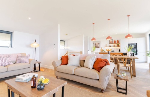 Widemouth Bay House | The Lighthouse is an end of terrace four bedroomed seafront retreat with a hot tub and incredible vi