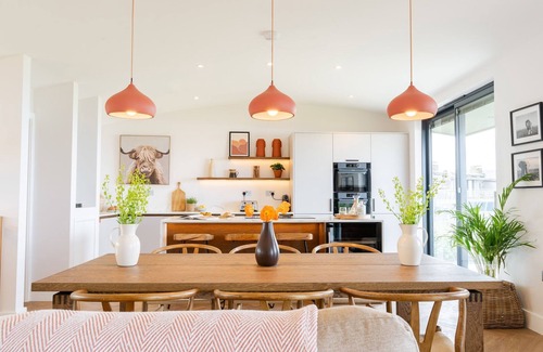 Widemouth Bay House | The Lighthouse is an end of terrace four bedroomed seafront retreat with a hot tub and incredible vi
