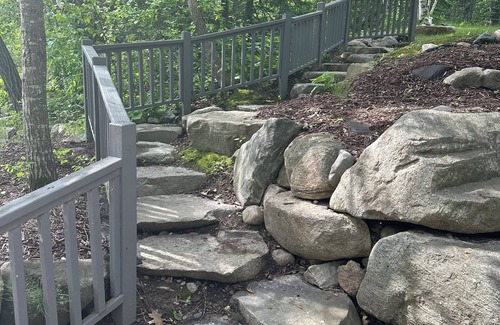 Puposky Cottage | The newly remodeled Stone Cabin with sandy beach and clean clear water