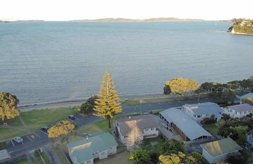 Snells Beach House | The Peach on the Beach! Pick up the paddle board and go!