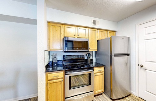 Indian Bayou Condo | Third-floor condo with balcony, pool, gym & central AC - 1/2 mile to the beach