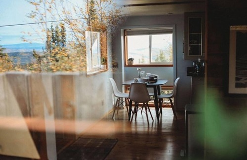 Fairbanks Ski Chalet | This A-frame is surrounded by mountain ranges that you can enjoy from the many windows