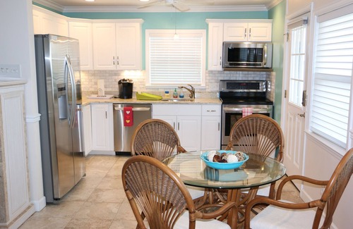 Lower Grand Lagoon House | This adorable cottage is DIRECTLY ON THE BEACH-RARE FIND!