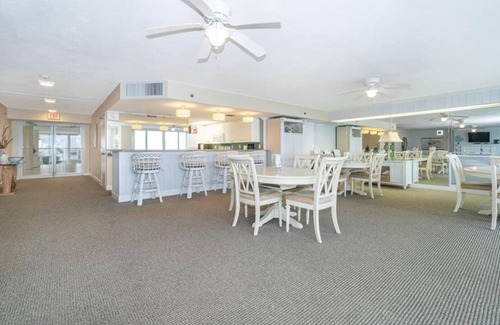 Ponce Inlet Condo | This stunning oceanfront 2BR condo in peaceful Ponce Inlet offers breathtaking beach views. Relax on the wraparound balcony with your morning coffee as pelicans glide by and dolphins surface in the waves below.