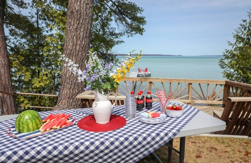 Rapid City House | Torch Lake Sandbar Waterfront Home - with Dock!