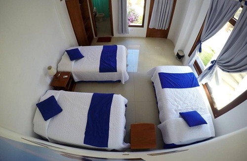 Puerto Villamil House | Tour to volcan, swim with sharks! Tripple Room Suite #1