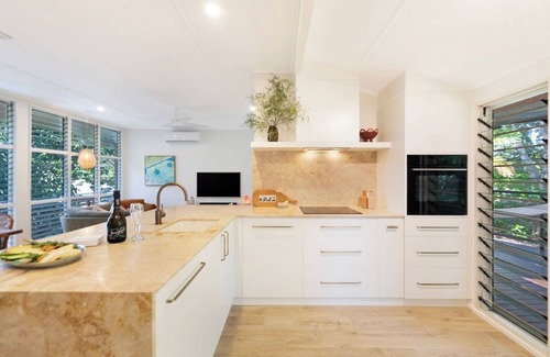 Rapid Creek House | Tropical Luxe Treehouse Lush Poolside Living