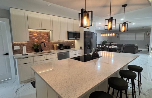 West Palm Beach Villa | Tropical Luxury Retreat with warm Pool, 5-bedroom & Mini Golf, Impact Windows
