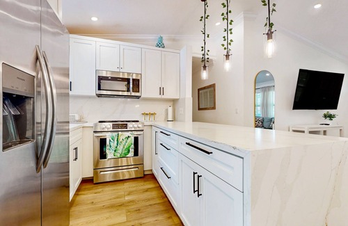 Hunt Club House | Tropical retreat with playground, pool, alfresco dining, bar, games, & streaming