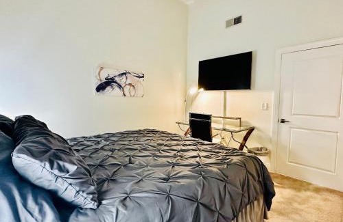 Mile Square Apartment | Two Bedroom Game Day Suite with 100 Projector TV