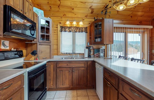 Greenville House | Two lakefront dog-friendly cabins on four acres with porches, dock, & lake views