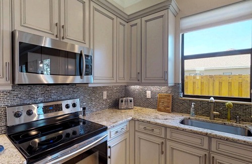 Naples Park House | Two Master Bedrooms! Less than 1 Mile to the beach with heated pool and spa