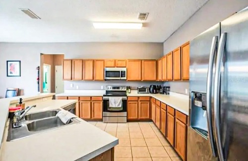 Windwood Bay House | Two-story home with private pool, screened patio, & BBQ - near golf/Disney