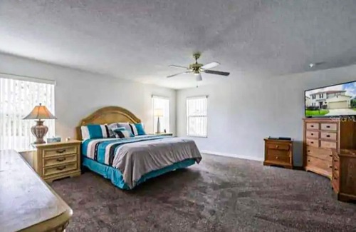Windwood Bay House | Two-story home with private pool, screened patio, & BBQ - near golf/Disney