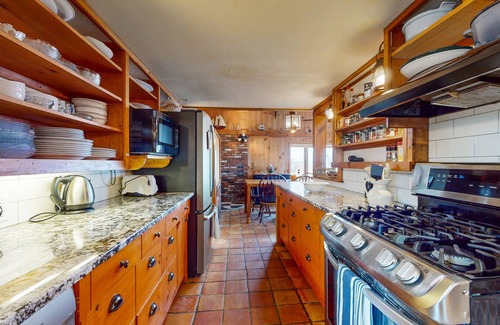 Newbury House | Two-story riverfront retreat with a furnished deck, views, & washer/dryer